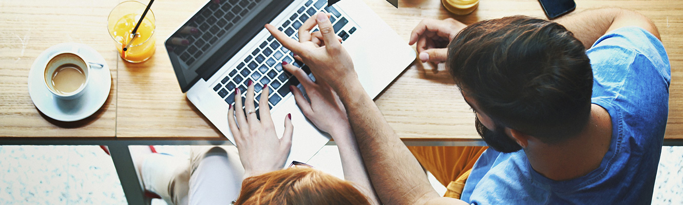 A couple using a laptop computer